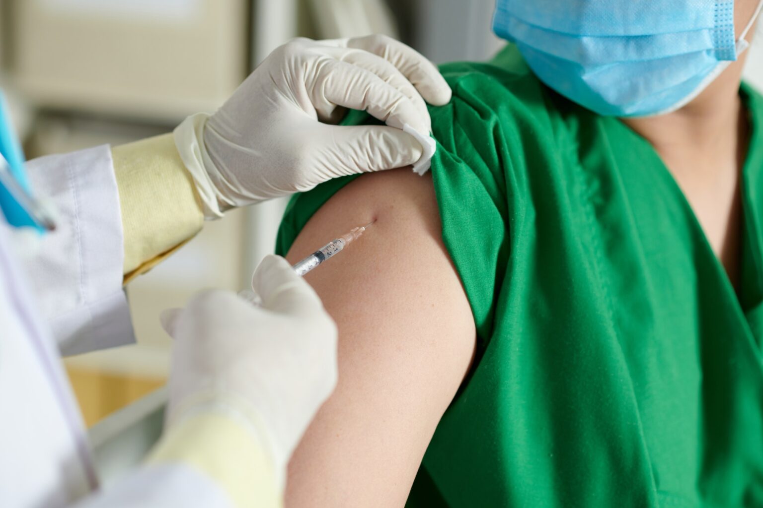 Doctor Making Injection of Vaccine Vaccines and Labs