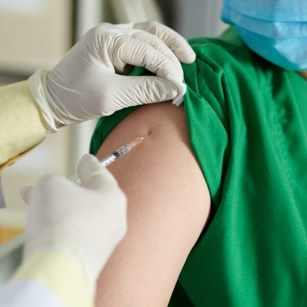 Doctor Making Injection of Vaccine Vaccines and Labs