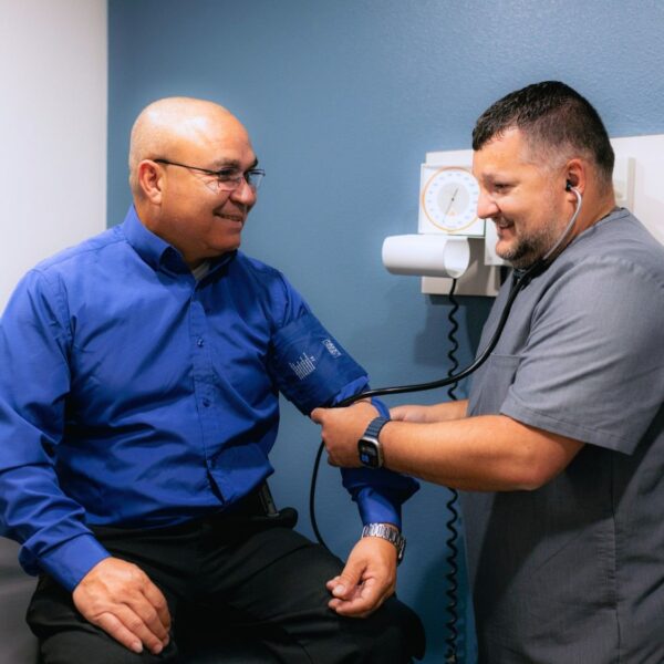 Men's Health Services at Community Health Centers of South Central Texas - Male patient with nurse