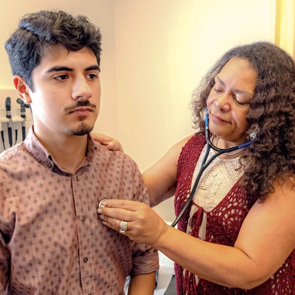 Men's Health Services at Community Health Centers of South Central Texas - Male patient with nurse