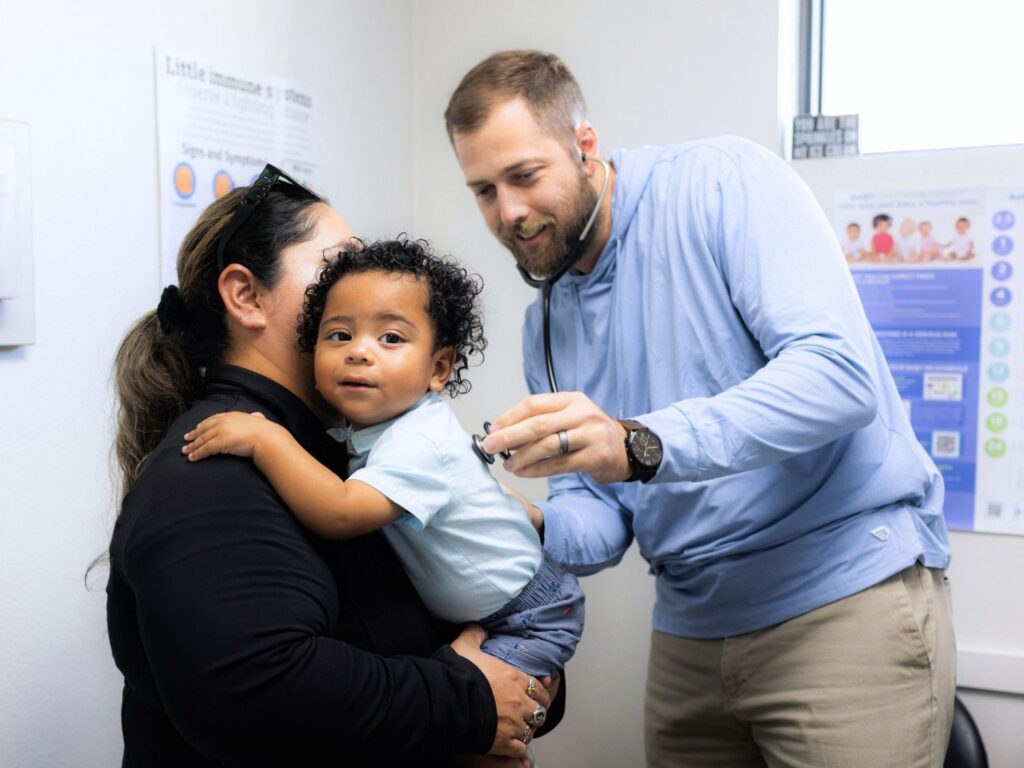 Pediatrician with a Cute Baby Patient for Pediatric Services, Well Visits, and Sick Visit