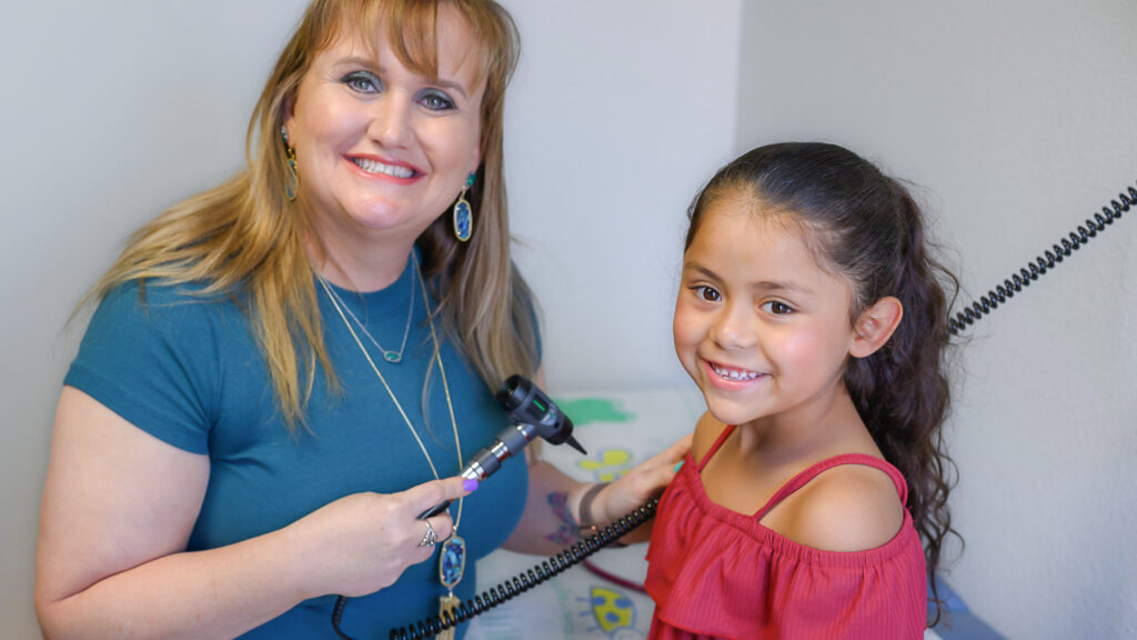 Bastrop ISD Health Center Nurse Cassandra with Pediatric Patient