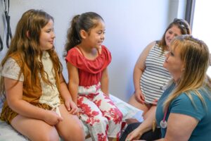 Bastrop ISD Health Center Nurse Cassandra with Pediatric Patients