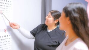 Nurse with patient for wellness vision exam