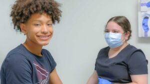 Pediatric patient with nurse at well visit