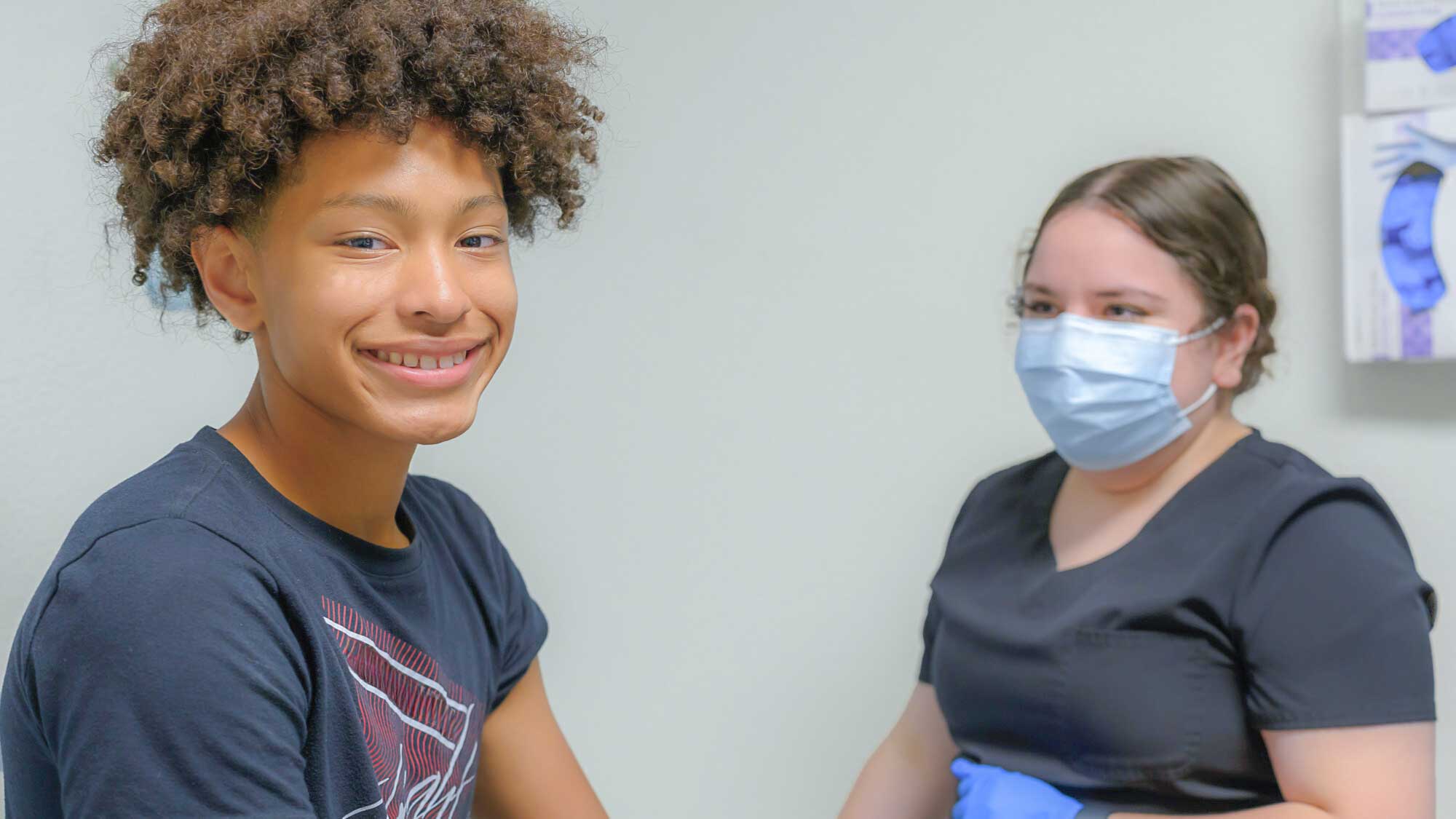 Pediatric patient with nurse at well visit