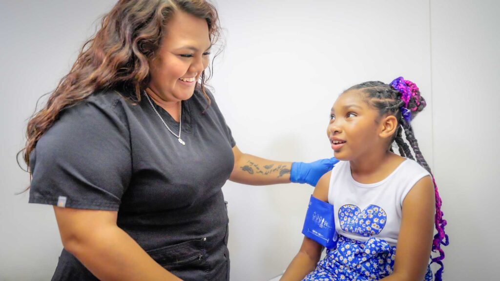 Pediatric Nurse with Patient