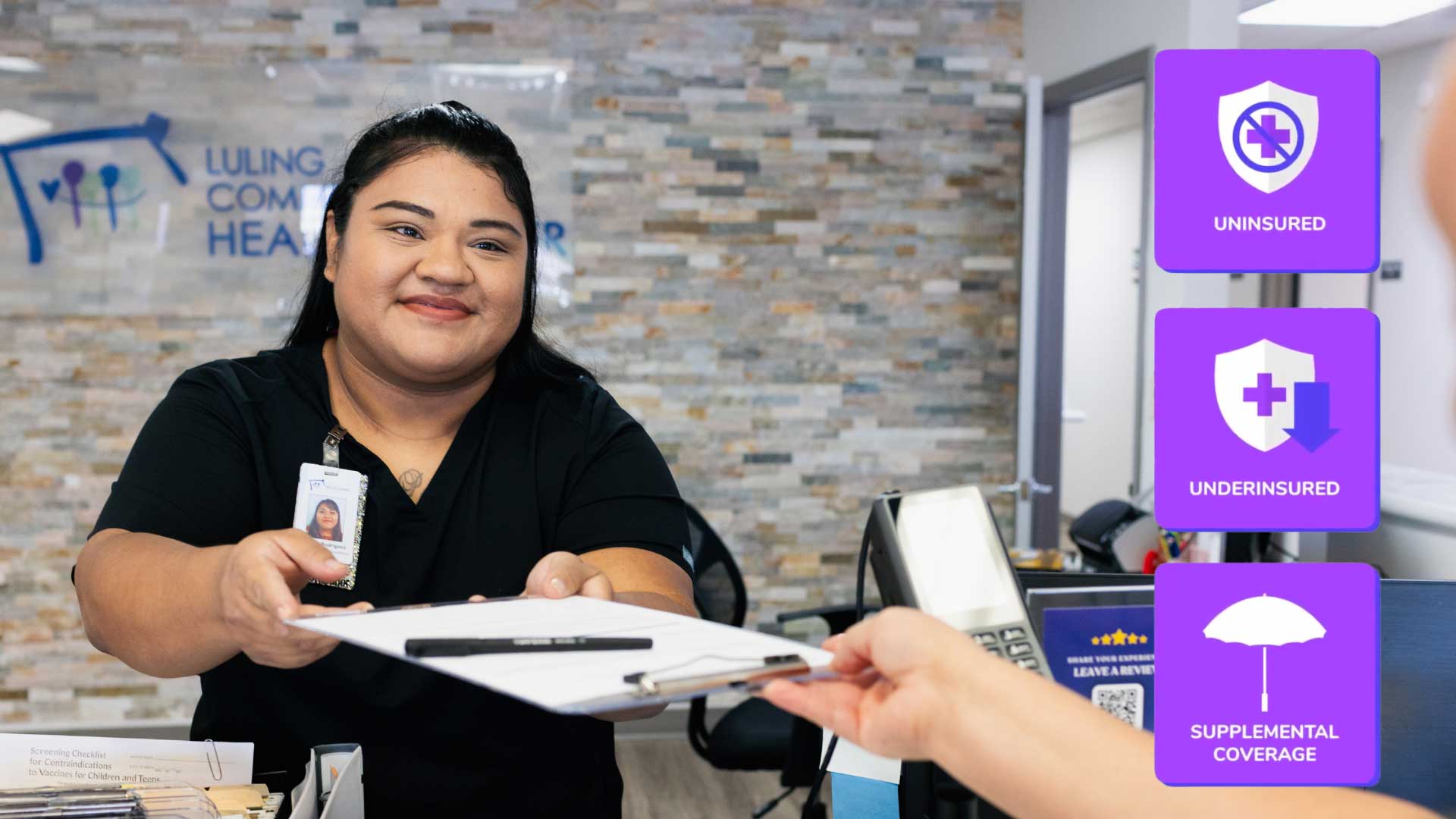 Eligibility Services and front desk check in staff handing paperwork