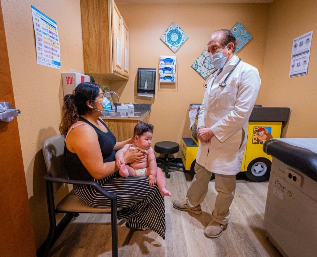 Jose Castaneda with mother and pediatric patient