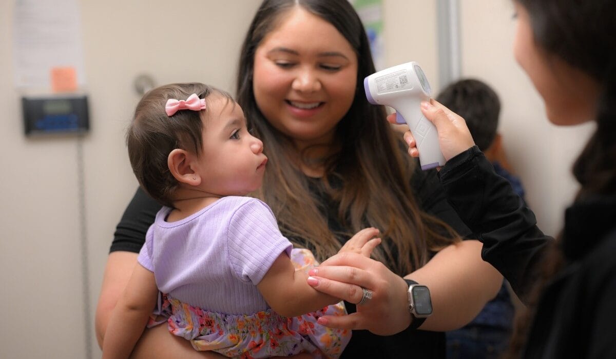 Pediatric Patient at Wellness Exam with Mother