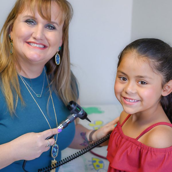 Bastrop ISD Health Center Nurse Cassandra with Pediatric Patient