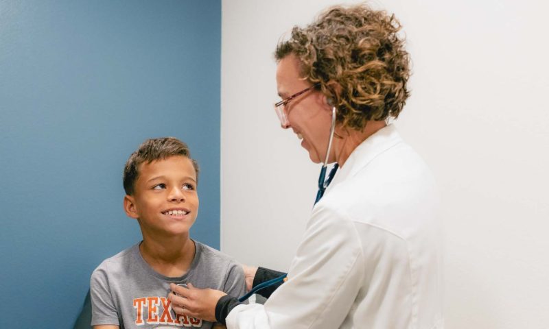 Dr. Fisher with Pediatric Patient