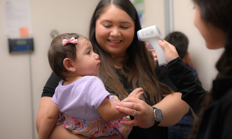 Pediatric Patient at Wellness Exam with Mother