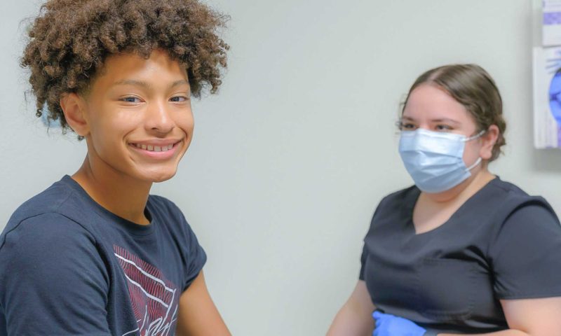 Pediatric patient with nurse at well visit
