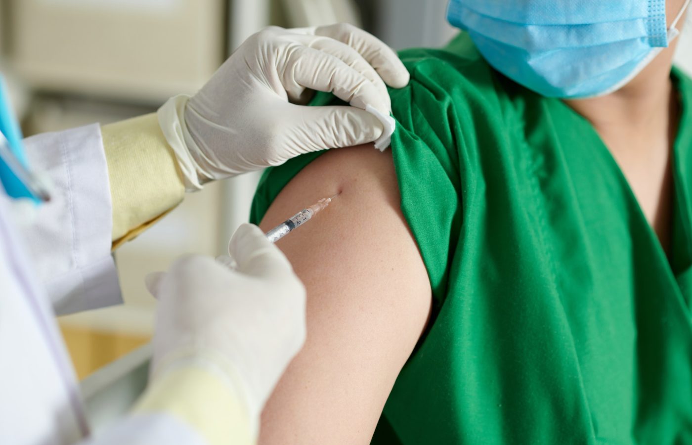 Doctor Making Injection of Vaccine Vaccines and Labs